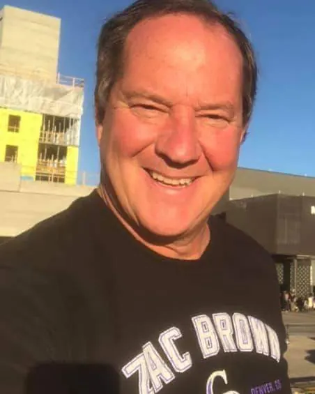 Pete Grosskreuz, owner of Deck Tune Up & Construction, smiling outdoors