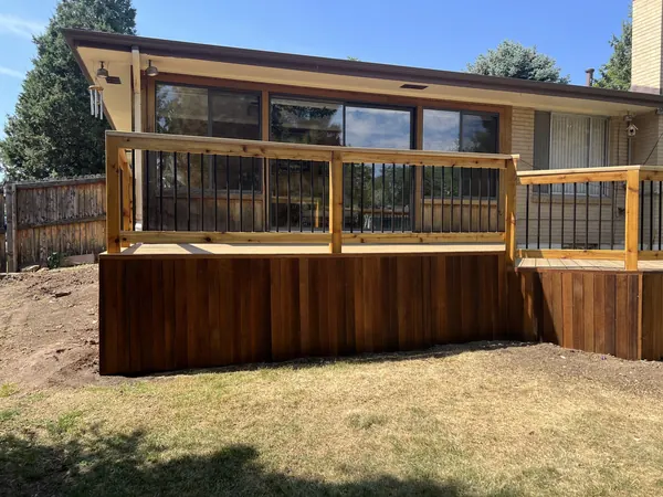Richard deck after: rebuilt deck with stained skirting and new cedar handrails