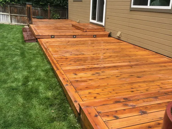 Swankee deck after: the same deck sanded and sealed to a warm cedar color